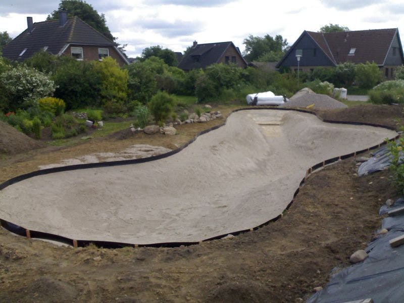 Swimming pond in the backyard of a single-family house